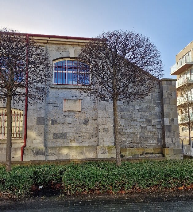 The plaque commemorating Dickie Bird, located on the side of Heuston, the former riding school