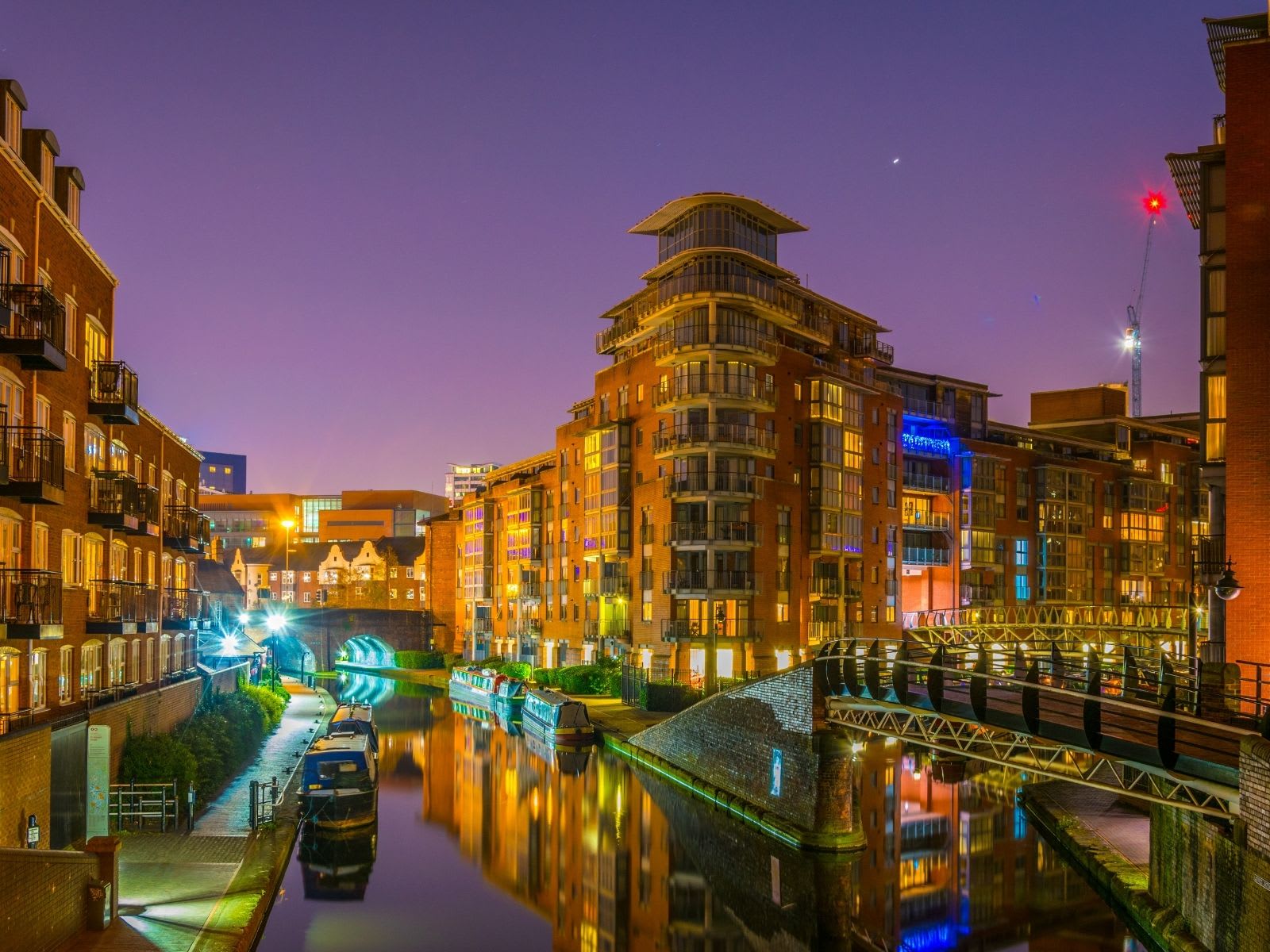 Night view of buildings alongside a water channel, Birmingham