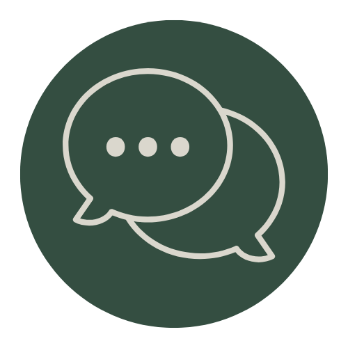 A white speech bubble icon on a dark background.