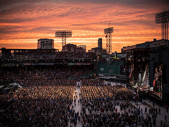 Crowd at Fenway Park during a concert at sunset