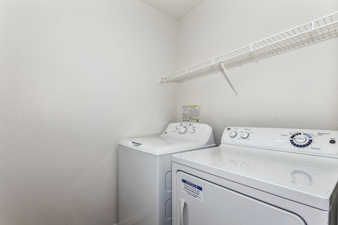 Laundry room at Colonial Pointe at Fairview Apartments