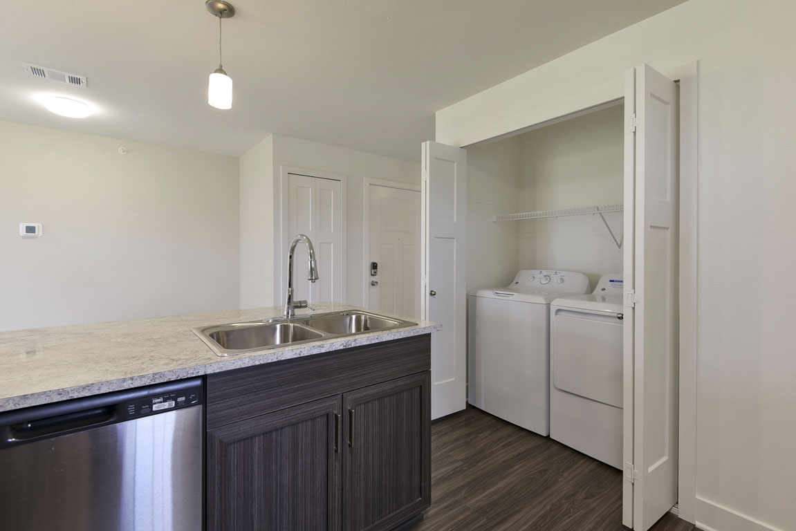 Laundry room at Dodson Pointe Apartment Homes (3 of 4)