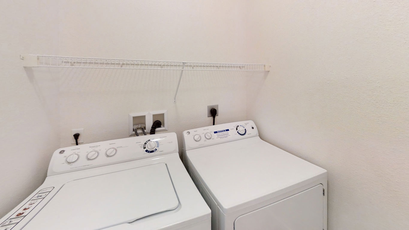 Laundry room at Lynbrook Apartments and Townhomes (3 of 3)