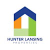 A logo for Hunter Lansing Properties featuring a house shape with three different colored sections.