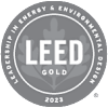 The image is of a LEED Gold certification logo for the year 2023.