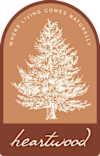 A logo with a tree and the words "Where Living Comes Naturally".