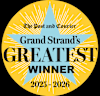 A circular emblem with a star design and text indicating "The Post and Courier Grand Strand's GREATEST WINNER 2025 - 2026".