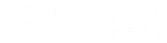 A green sign with the words South Park Lofts.