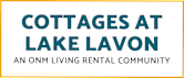 A sign that says Cottages at Lake Lavon, an ONM living rental community.