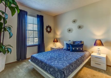 Bedroom With Expansive Windows at Lake Forest Apartments, Westerville, OH