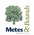 A logo for a management company with a tree and the words "Metes & Bounds".