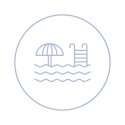 a white circle on a black background with an umbrella and a chair at The Box, Virginia