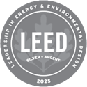 A circular emblem with the text "LEED" in the center, surrounded by the phrases "Leadership in Energy & Environmental Design", "Silver", "Argent", and the year "2025".