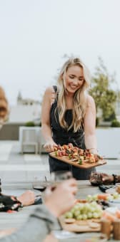Woman And Rooftop Grill at Residences at Richmond Trust, Richmond