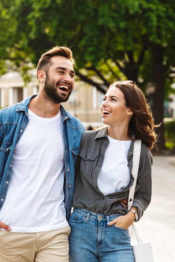 Happy couple walking together at Brea Grove Residences Apartments, Brea, CA, 92821