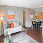 a living room with a couch and a table at The Entro at Midtown, Dallas