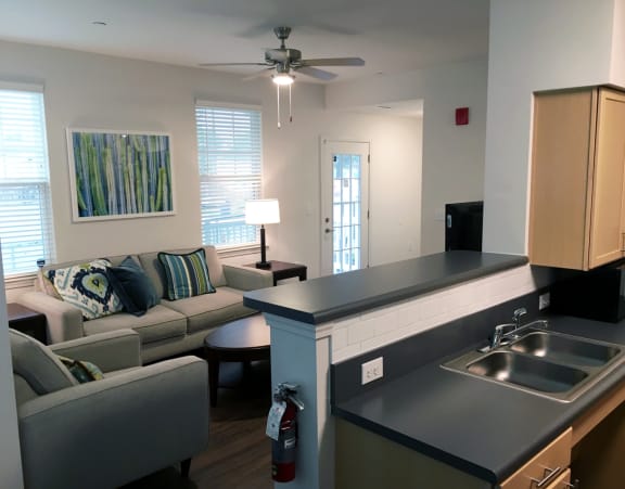 a kitchen and living room in an apartment