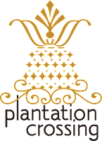 A black and gold logo for plantation crossing.
