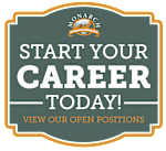 A sign advertising Monarch Investment and Management Company's open positions.