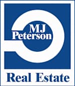 a white and blue real estate sign with the words real estate