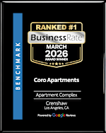 A black and gold award for the top business rate for Coro Apartments in March 2026.