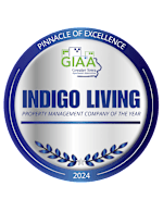 A blue and white award sign for the Pinnacle Property Management Company of the Year for 2024.