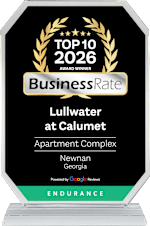 A black and white award sign for Lullwater at Calumet Apartment Complex in Newnan, Georgia.