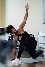 Woman stretching at Scout Living, powered by Placemakr, Atlanta, GA, 30308