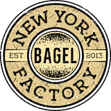A stamp-like image with the words New York Bagel Factory and the year 2013. at Trio Newton Apartments, Massachusetts, 02460
