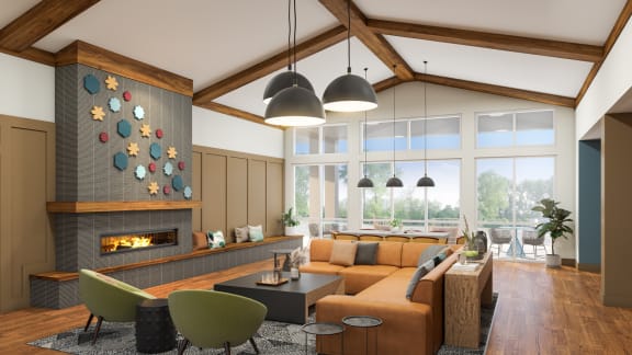 a lobby with a couch and chairs and a fire place