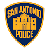 The image is of a San Antonio Police badge.