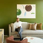 Man sitting on couch at Scout Living, powered by Placemakr, Atlanta, GA, 30308