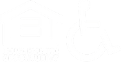 A black and white image of a house and a wheelchair.