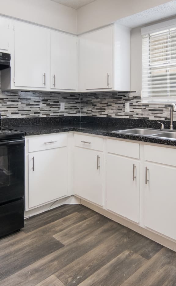 Kitchen with Black Appliances at Preston Villas Apartment Homes, Dallas, Texas, TX