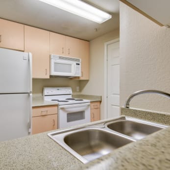 Unit Kitchen at On The Green Apartments in Austin, Texas, TX
