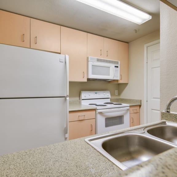Unit Kitchen at On The Green Apartments in Austin, Texas, TX
