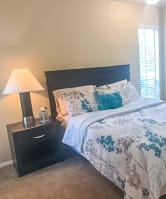 Model Unit Bedroom at Woodlands of Plano Apartments in Plano, TX