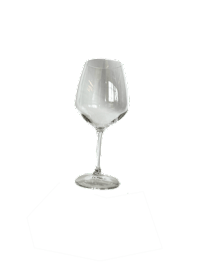 A clear wine glass on a black background