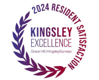 a circular logo with the words kingsley excellence with purple leaves