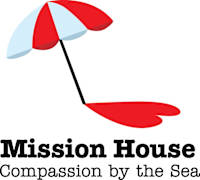An umbrella with the words Mission House written on it.
