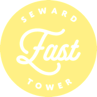 A yellow circle with the words "Seward Fast Tower" written in white.