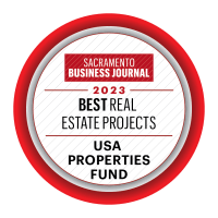a circular sign with the best real estate projects in red and white