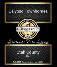 A black and gold framed certificate for Calypso Townhomes.