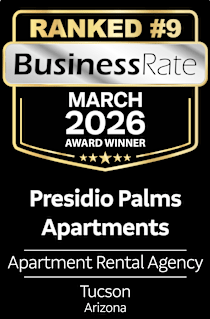 A black and gold award sign for Presidio Palms Apartments.