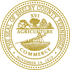A gold and white emblem for the Seal of Shelby County Tennessee.