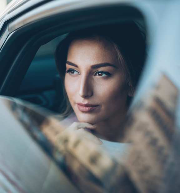A Women Looking Out of a Car Window at Casa Mira View Apartments, San Diego, California