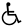 a silhouetted wheelchair icon on a green