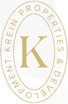 A logo with the letter K in the center and the words "Krein Properties & Development" surrounding it.
