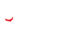 A red devil face is in front of some white grass.