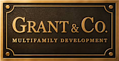 A sign that says Grant & Co. Multifamily Development.